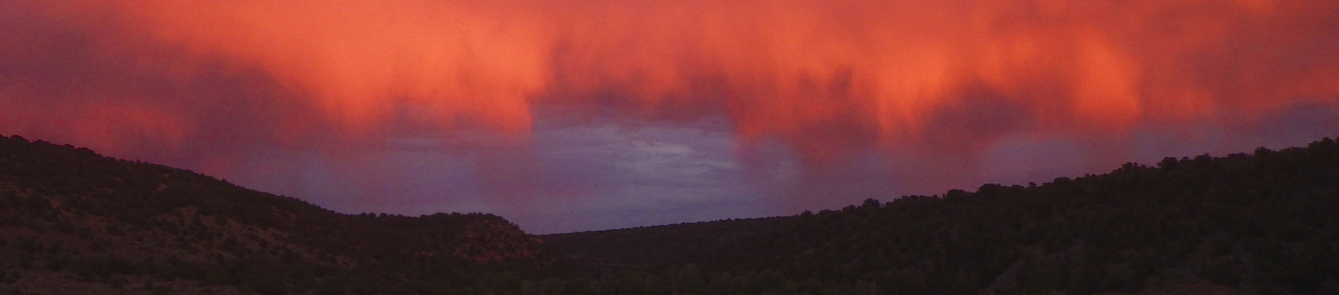 header image of red and orange clouds